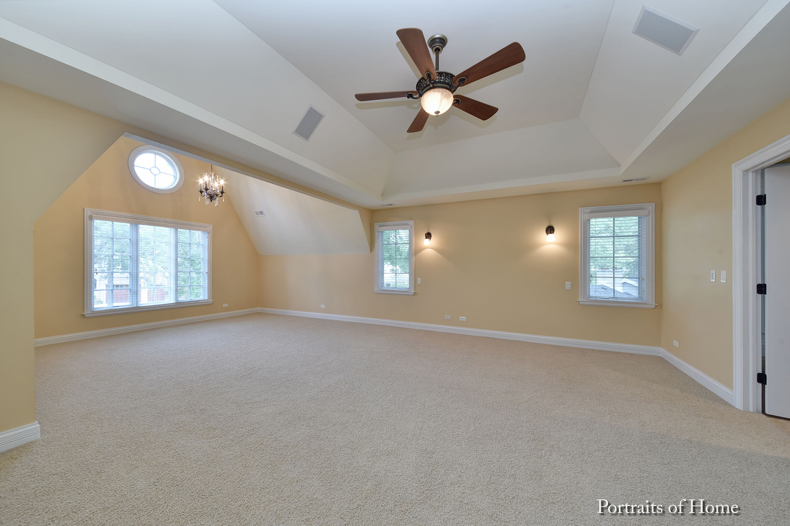 606 Wellner Road Naperville, IL 60540 - Photo 19 of 30 an empty room with windows and fan
