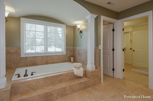 606 Wellner Road Naperville, IL 60540 - Photo 20 of 30 a spacious bathroom with a bathtub and a shower