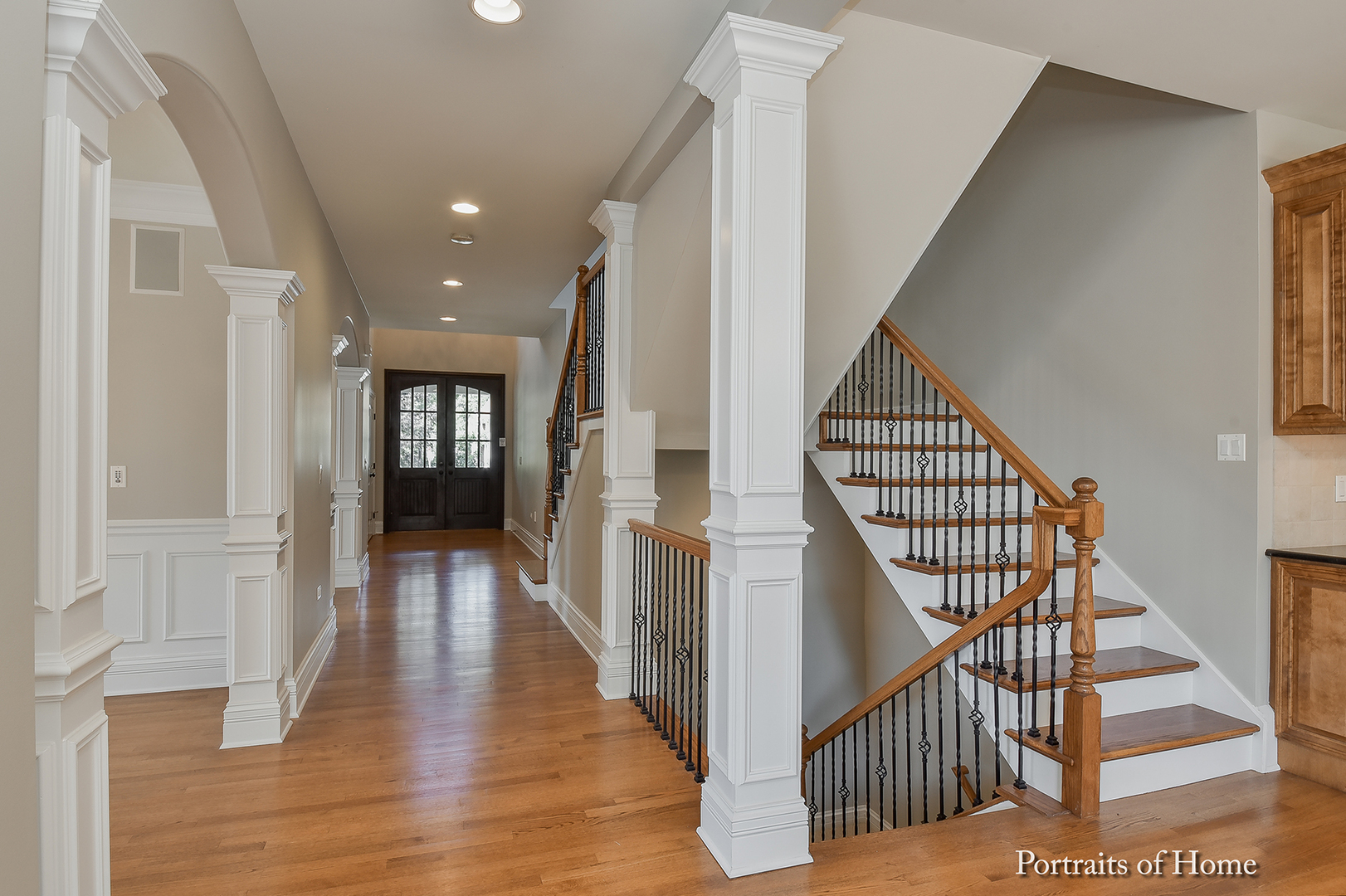 606 Wellner Road Naperville, IL 60540 - Photo 5 of 30 a view of entryway with wooden floor and stairs