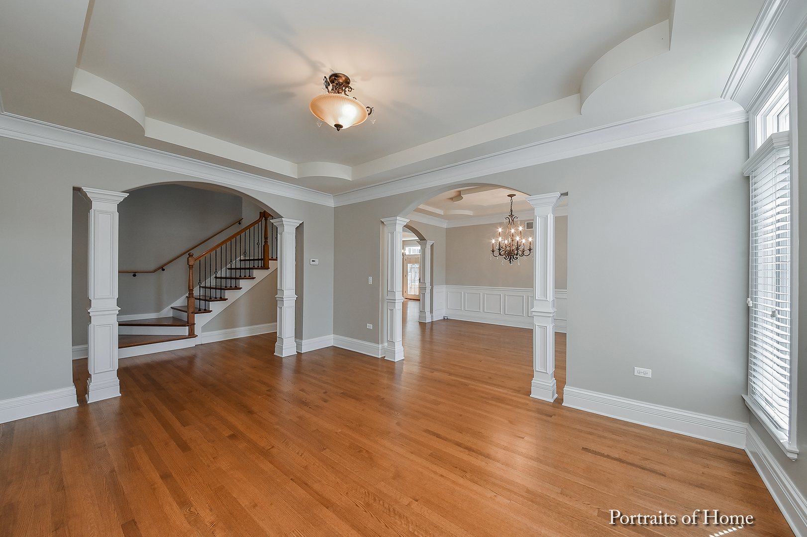 606 Wellner Road Naperville, IL 60540 - Photo 6 of 30 a view of an empty room and wooden floor