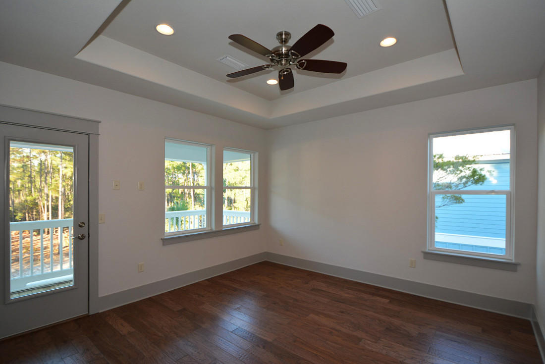 50 Mobile Street Miramar Beach, FL 32550 - Photo 15 of 28 a view of an empty room with wooden floor and a window
