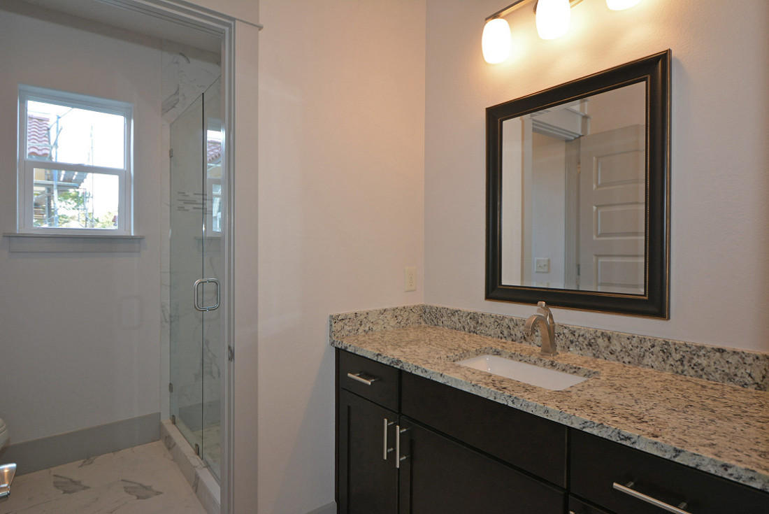 50 Mobile Street Miramar Beach, FL 32550 - Photo 18 of 28 a bathroom with a granite countertop sink and a mirror