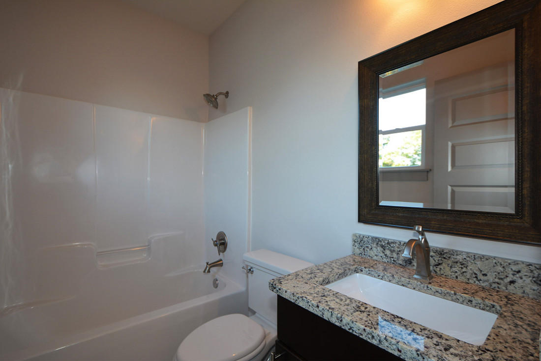 50 Mobile Street Miramar Beach, FL 32550 - Photo 24 of 28 a bathroom with a granite countertop toilet sink and mirror