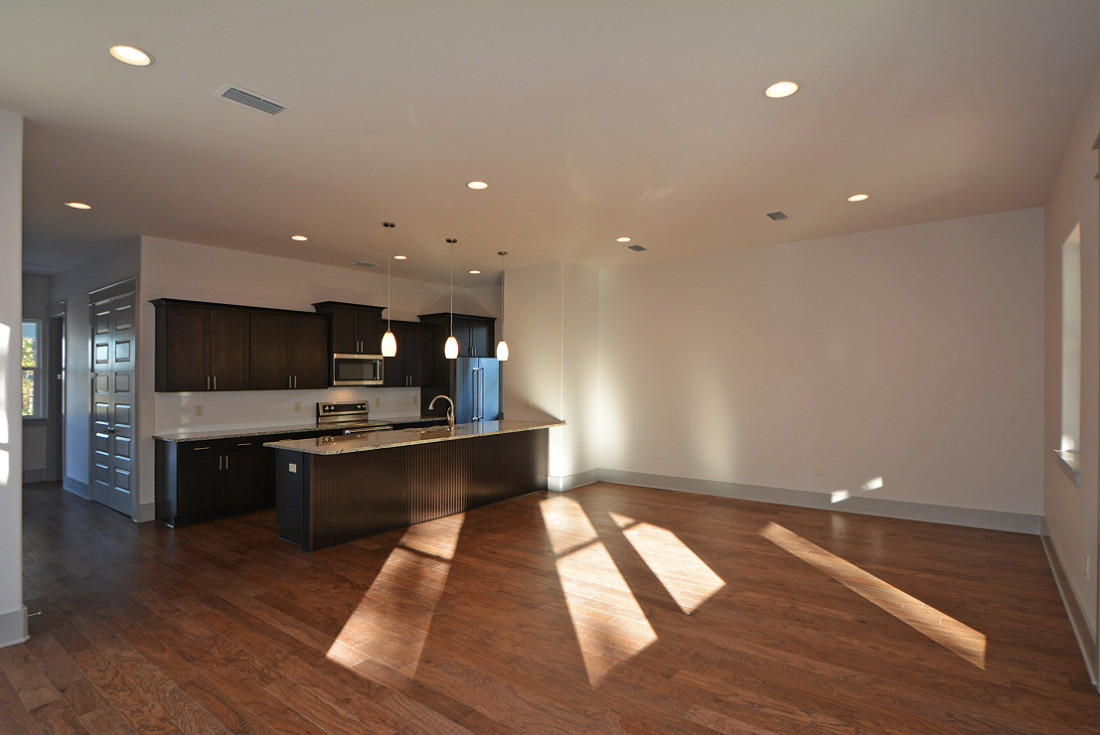 50 Mobile Street Miramar Beach, FL 32550 - Photo 5 of 28 a large kitchen with stainless steel appliances a large counter top a refrigerator and a sink