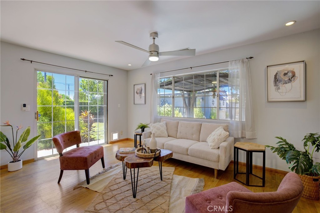 7001 Lindley Avenue Reseda, CA 91335 - Photo 15 of 45 a living room with furniture and a large window