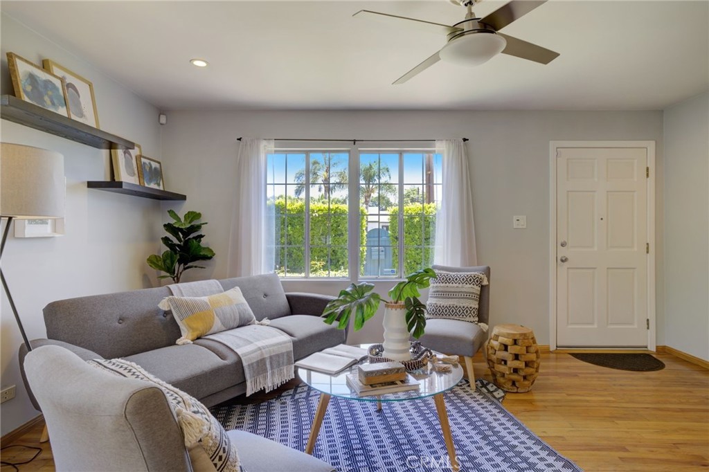 7001 Lindley Avenue Reseda, CA 91335 - Photo 2 of 45 a living room with furniture and a window