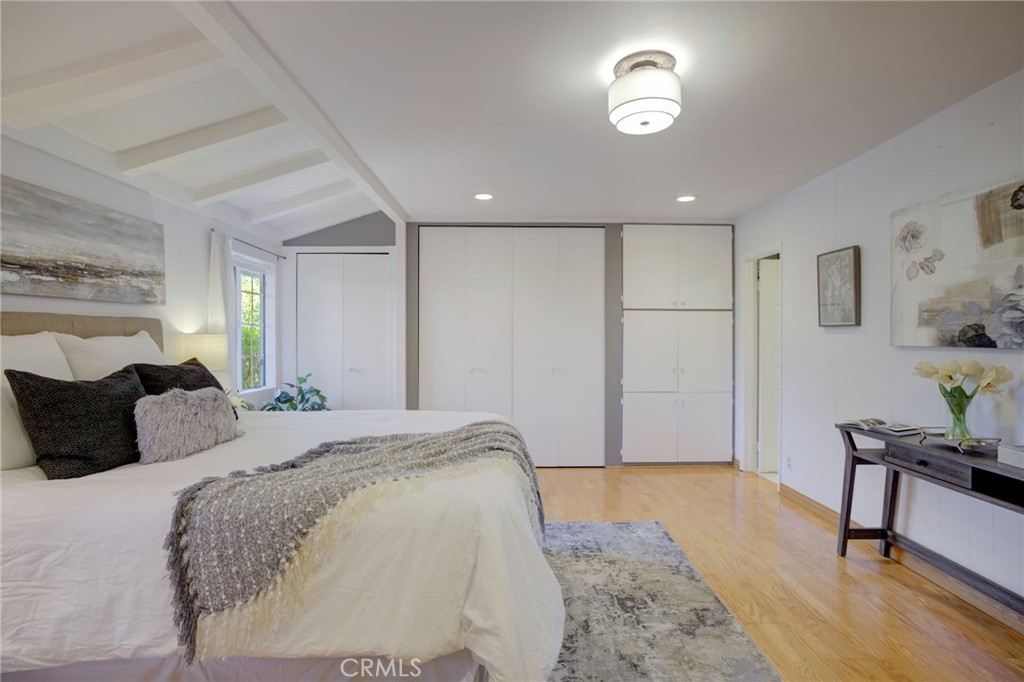 7001 Lindley Avenue Reseda, CA 91335 - Photo 22 of 45 a bedroom with a bed and a dresser