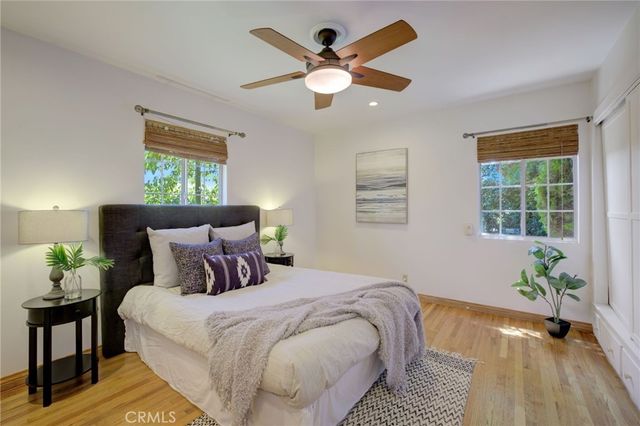a bedroom with bed and window