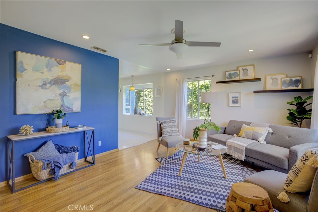 7001 Lindley Avenue Reseda, CA 91335 - Photo 3 of 45 a living room with furniture and wooden floor