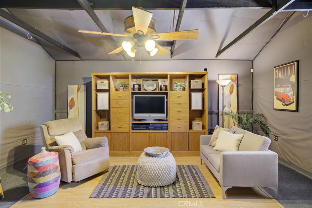7001 Lindley Avenue Reseda, CA 91335 - Photo 32 of 45 a living room with furniture and a flat screen tv