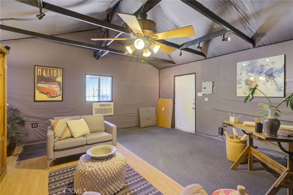 7001 Lindley Avenue Reseda, CA 91335 - Photo 33 of 45 a living room with furniture and a rug