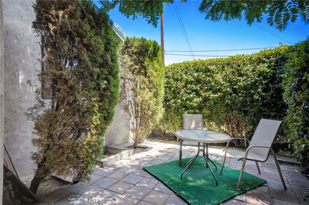 7001 Lindley Avenue Reseda, CA 91335 - Photo 40 of 45 a backyard of a house with table and chairs