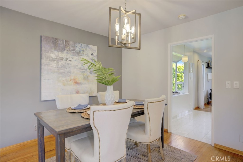7001 Lindley Avenue Reseda, CA 91335 - Photo 10 of 45 a view of a dining room with furniture and wooden floor