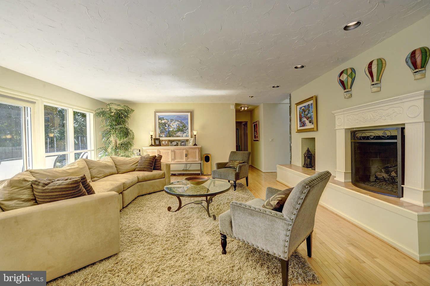 10009 Hall Road Potomac, MD 20854 - Photo 4 of 10 a living room with furniture and a fireplace