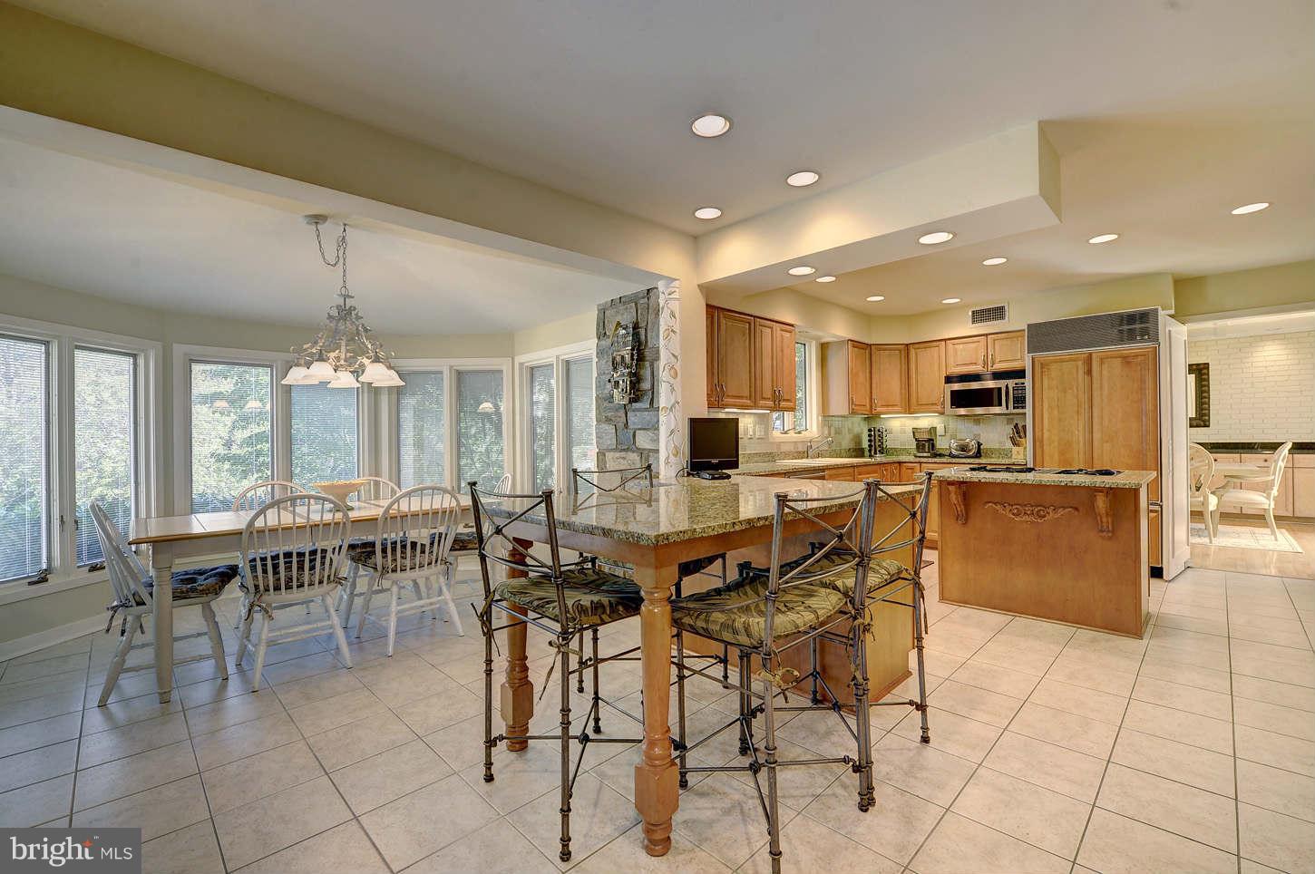 10009 Hall Road Potomac, MD 20854 - Photo 5 of 10 a group of people sitting kitchen and dining room