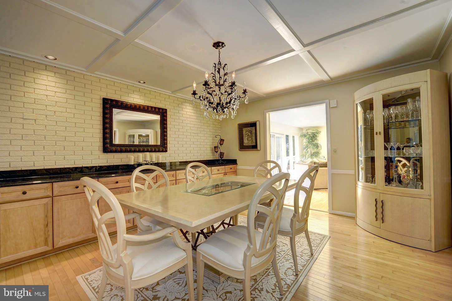 10009 Hall Road Potomac, MD 20854 - Photo 6 of 10 a view of a dining room with furniture and chandelier