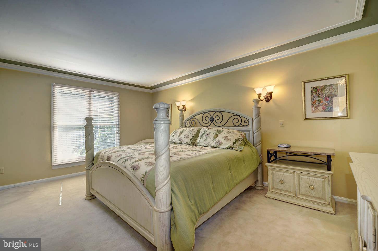10009 Hall Road Potomac, MD 20854 - Photo 7 of 10 a bedroom with a bed and window