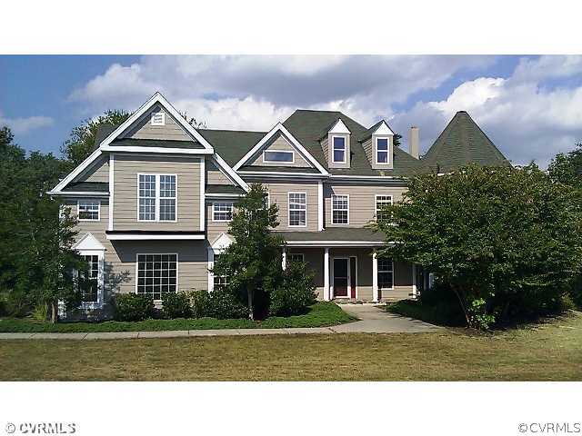 4212 Whitehall Road Sandy Hook, VA 23153 - Photo 1 of 9 a front view of a house with a yard