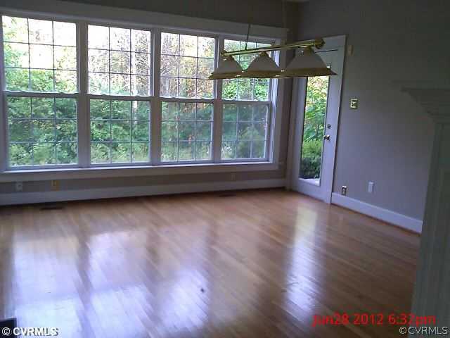 4212 Whitehall Road Sandy Hook, VA 23153 - Photo 6 of 9 a view of room with window and wooden floor