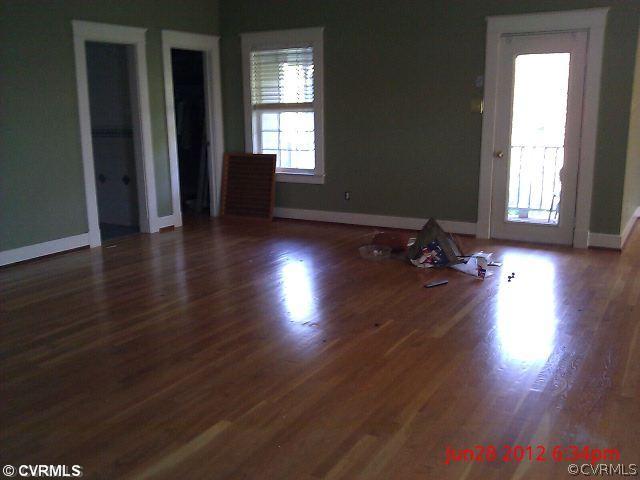 4212 Whitehall Road Sandy Hook, VA 23153 - Photo 9 of 9 an empty room with wooden floor and windows