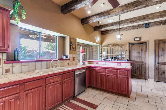 a kitchen with a sink and cabinets