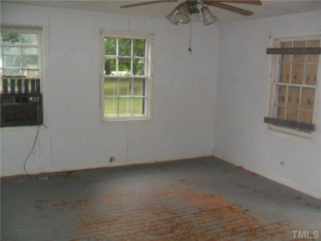 2402 Redwood Road Durham, NC 27704 - Photo 5 of 10 an empty room with a window