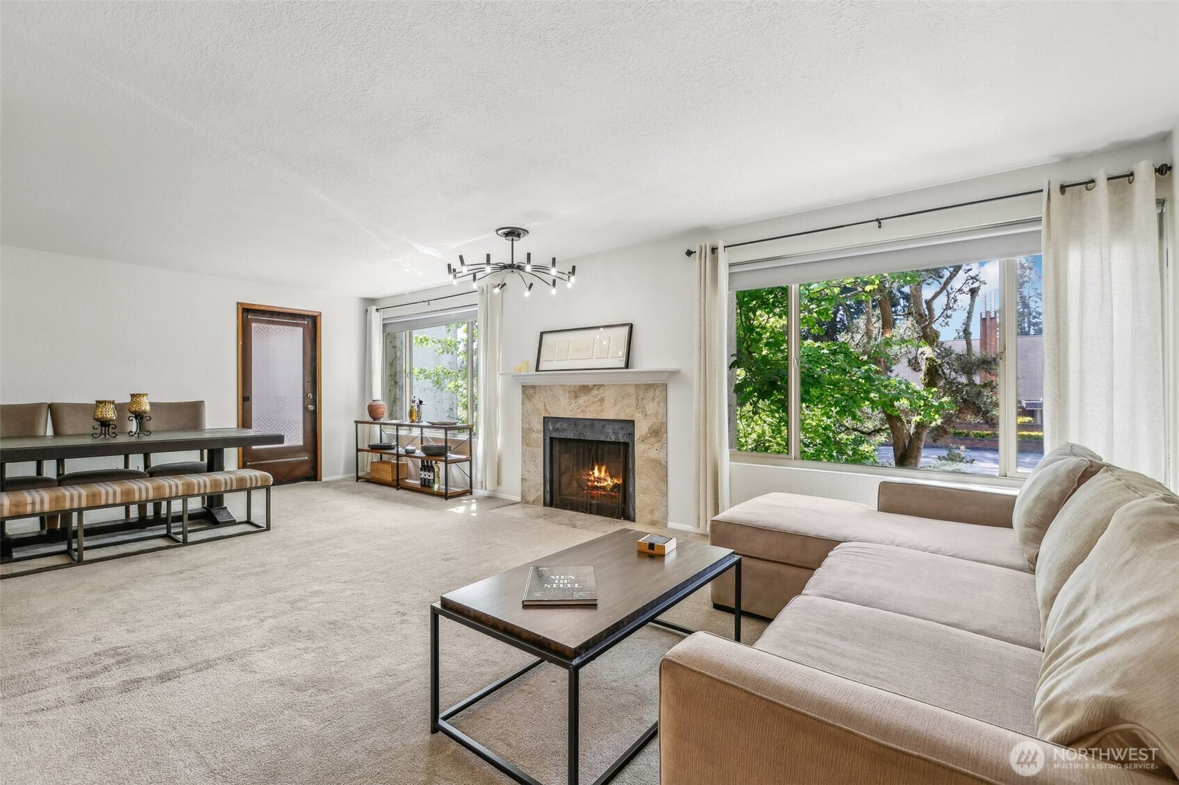 a living room with furniture and a fireplace