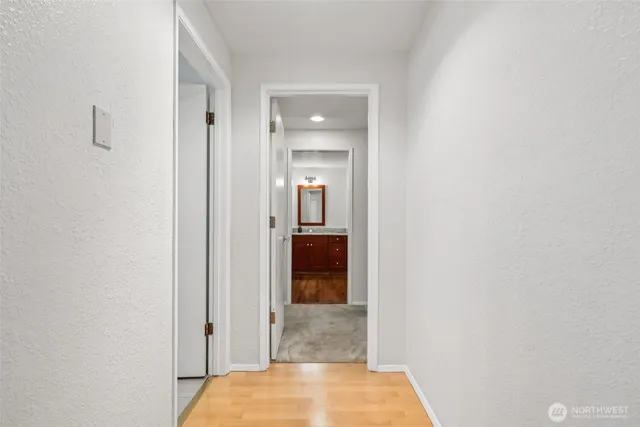 a view of a bathroom from a hallway