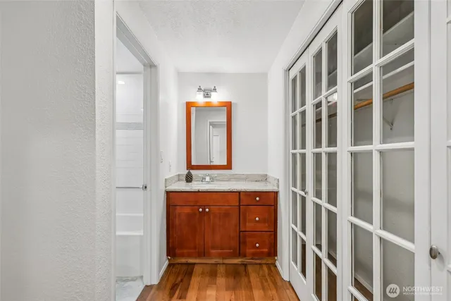 a view of front door with wooden floor