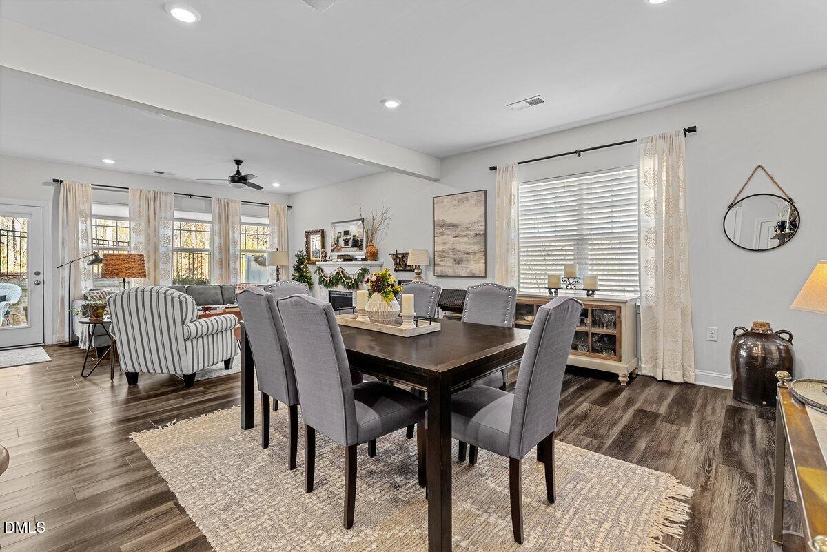 100 Masden Road Holly Springs, NC 27540 - Photo 9 of 39 a view of a dining room with furniture and wooden floor