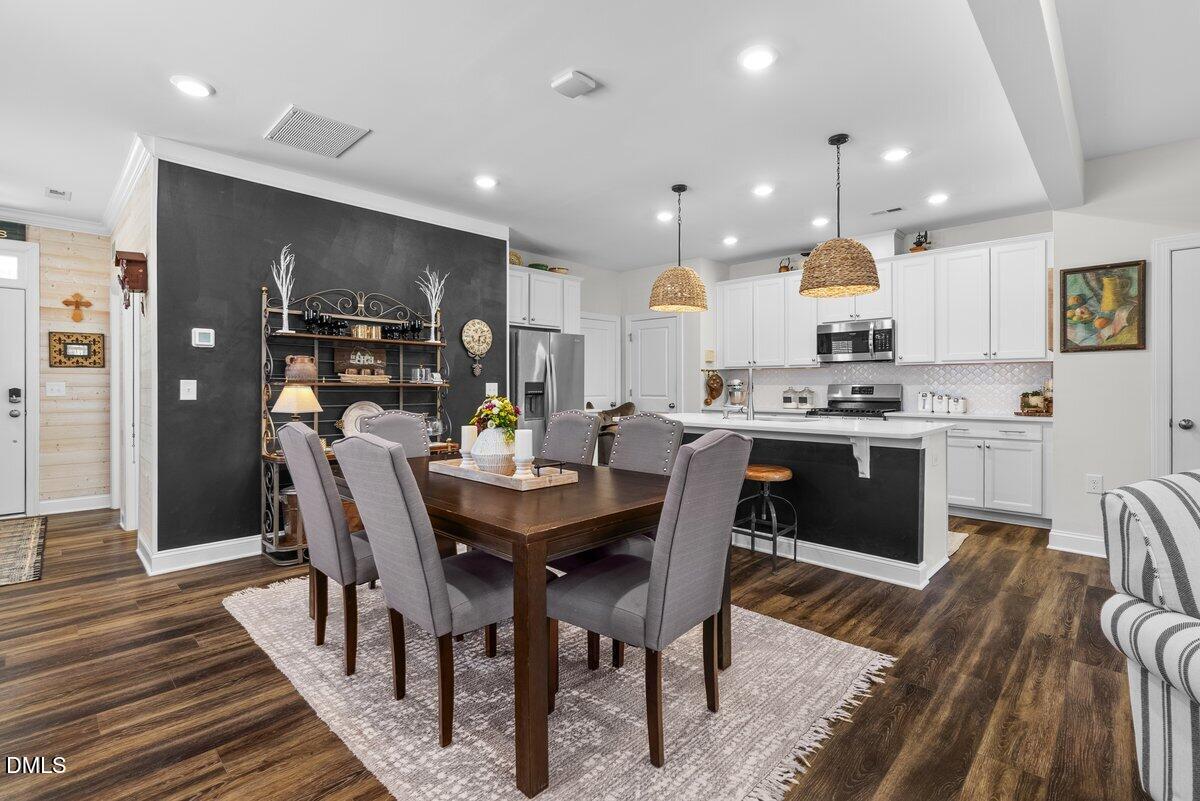 100 Masden Road Holly Springs, NC 27540 - Photo 10 of 39 a view of a dining room with furniture