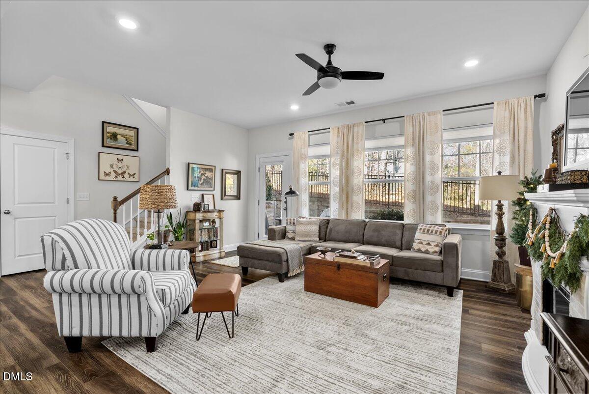100 Masden Road Holly Springs, NC 27540 - Photo 11 of 39 a living room with furniture or couch and a flat screen tv