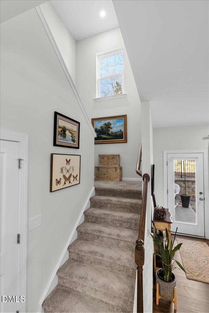 100 Masden Road Holly Springs, NC 27540 - Photo 15 of 39 a view of a hallway with paintings on the wall