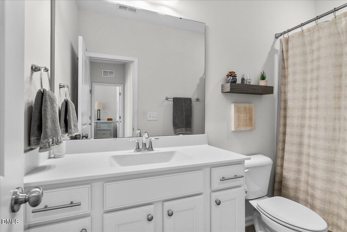 100 Masden Road Holly Springs, NC 27540 - Photo 24 of 39 a bathroom with a sink toilet and shower