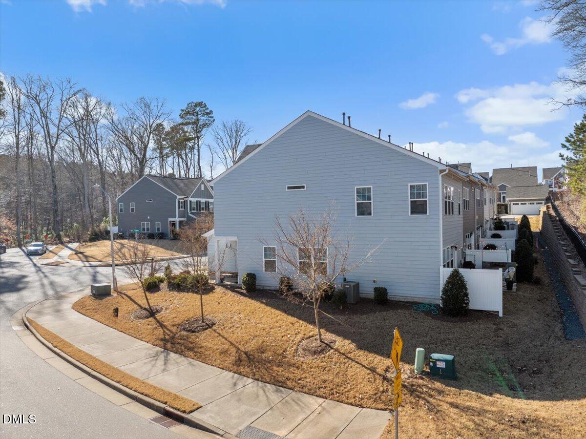 100 Masden Road Holly Springs, NC 27540 - Photo 26 of 39 a view of a terrace with chairs and potted plants