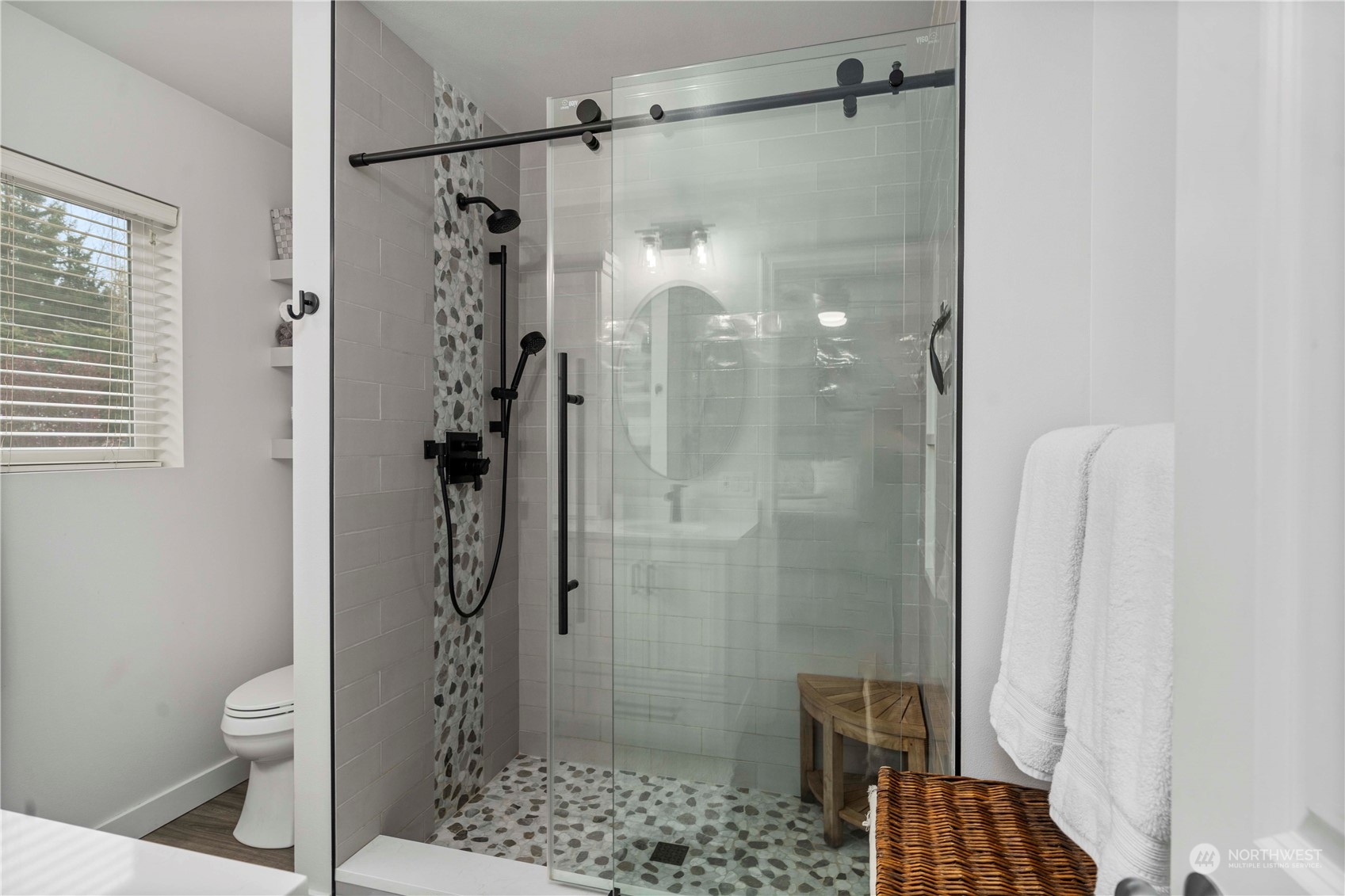 28002 Maple Ridge Way Southeast Maple Valley, WA 98038 - Photo 19 of 33 a bathroom with a shower toilet and sink