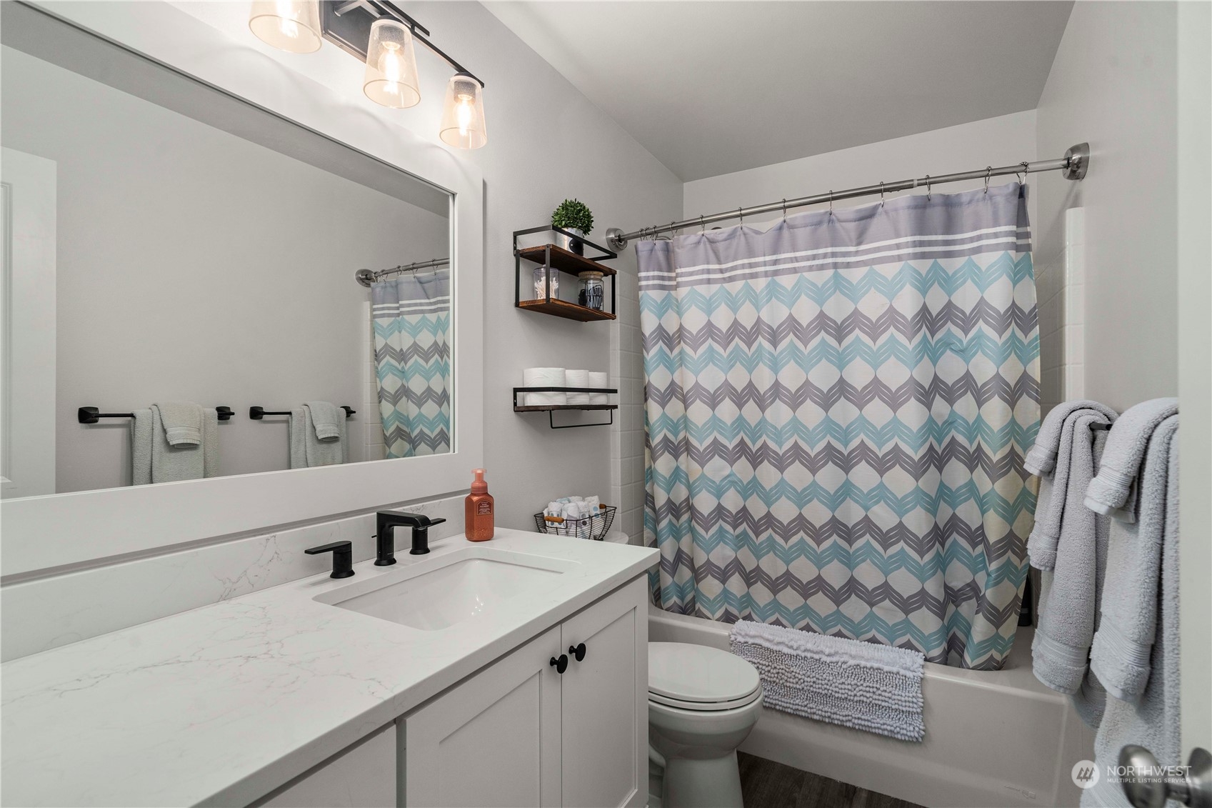 28002 Maple Ridge Way Southeast Maple Valley, WA 98038 - Photo 22 of 33 a bathroom with a sink toilet and shower