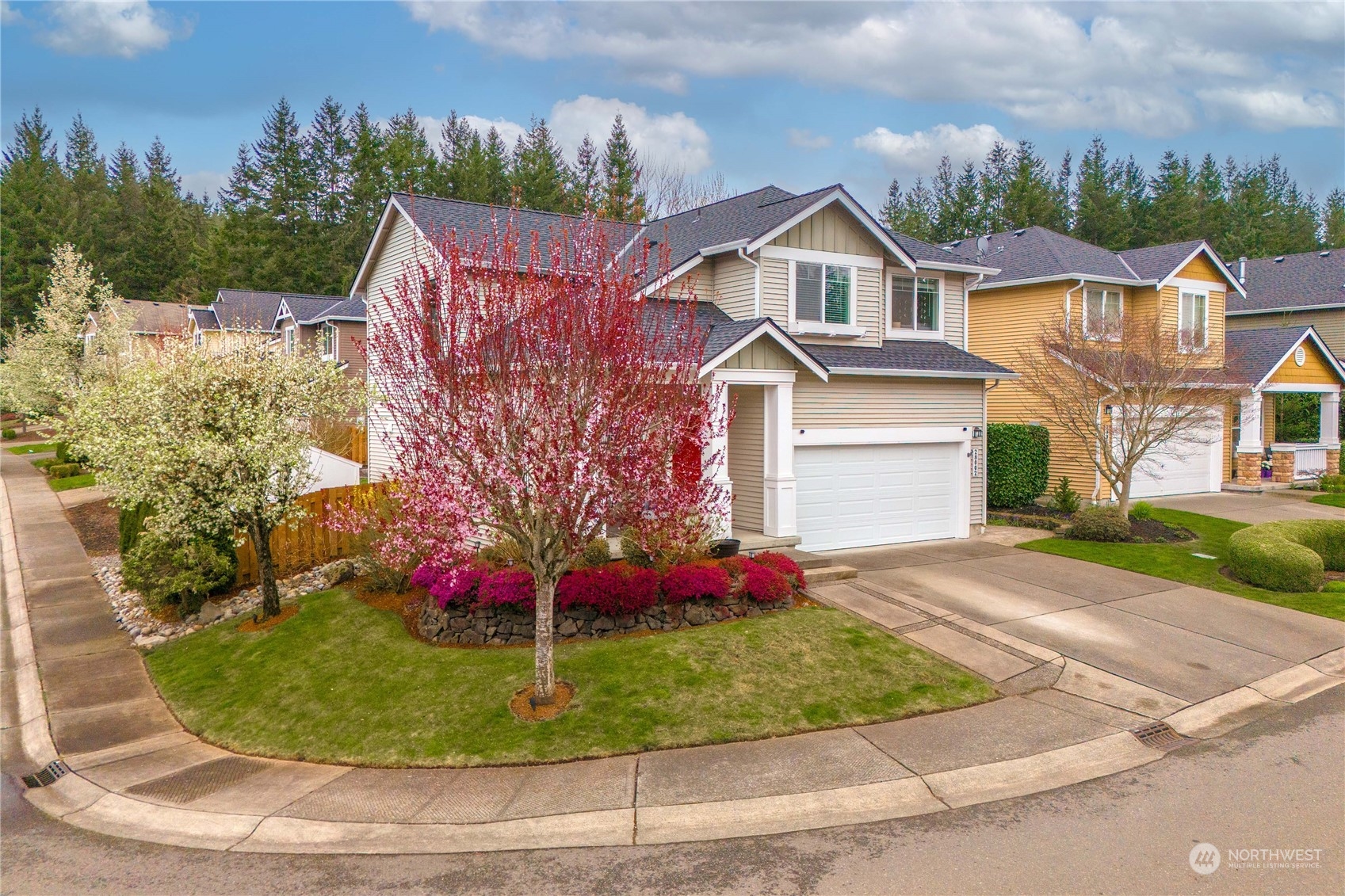28002 Maple Ridge Way Southeast Maple Valley, WA 98038 - Photo 33 of 33 a front view of a house with a yard and potted plants