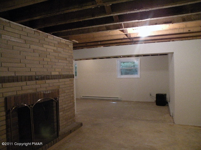 715 Deer Run Road Pocono Lake, PA 18347 - Photo 13 of 20 a view of livingroom with fireplace