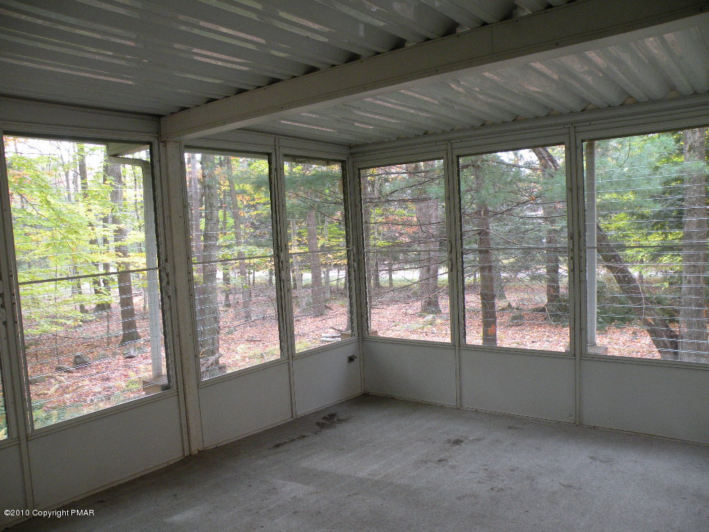 715 Deer Run Road Pocono Lake, PA 18347 - Photo 15 of 20 a view of an empty room with a window