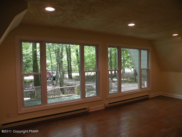 715 Deer Run Road Pocono Lake, PA 18347 - Photo 4 of 20 a view of an empty room with a window
