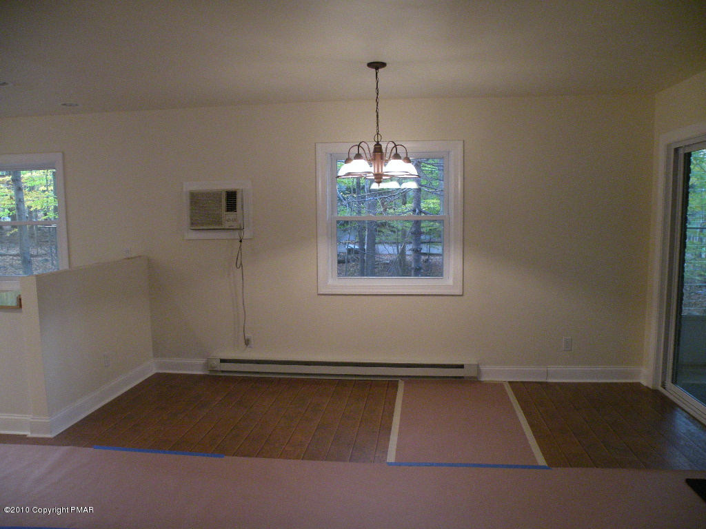 715 Deer Run Road Pocono Lake, PA 18347 - Photo 5 of 20 an empty room with windows