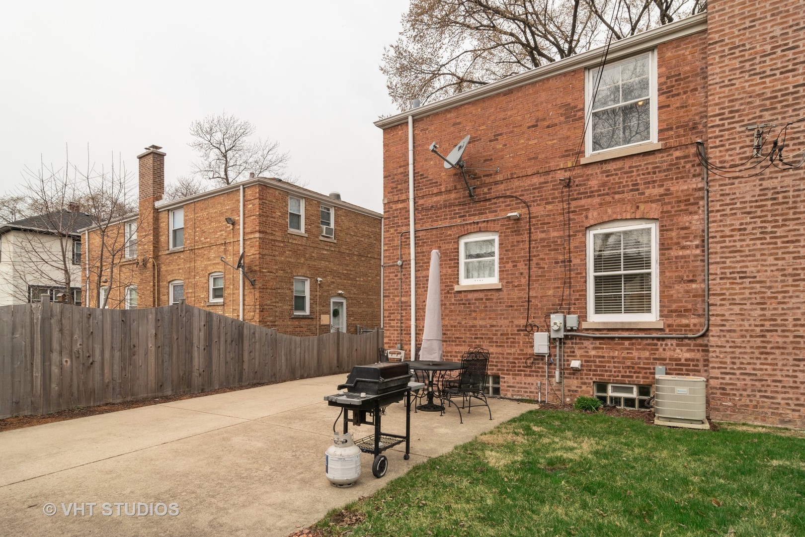 159 East Burlington Street Riverside, IL 60546 - Photo 11 of 19 a backyard of a house with table and chairs