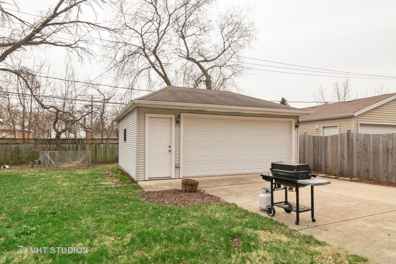 159 East Burlington Street Riverside, IL 60546 - Photo 12 of 19 a backyard of a house with table and chair