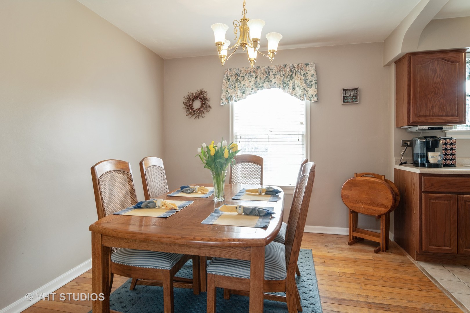 159 East Burlington Street Riverside, IL 60546 - Photo 4 of 19 a view of a dining room with furniture and chandelier