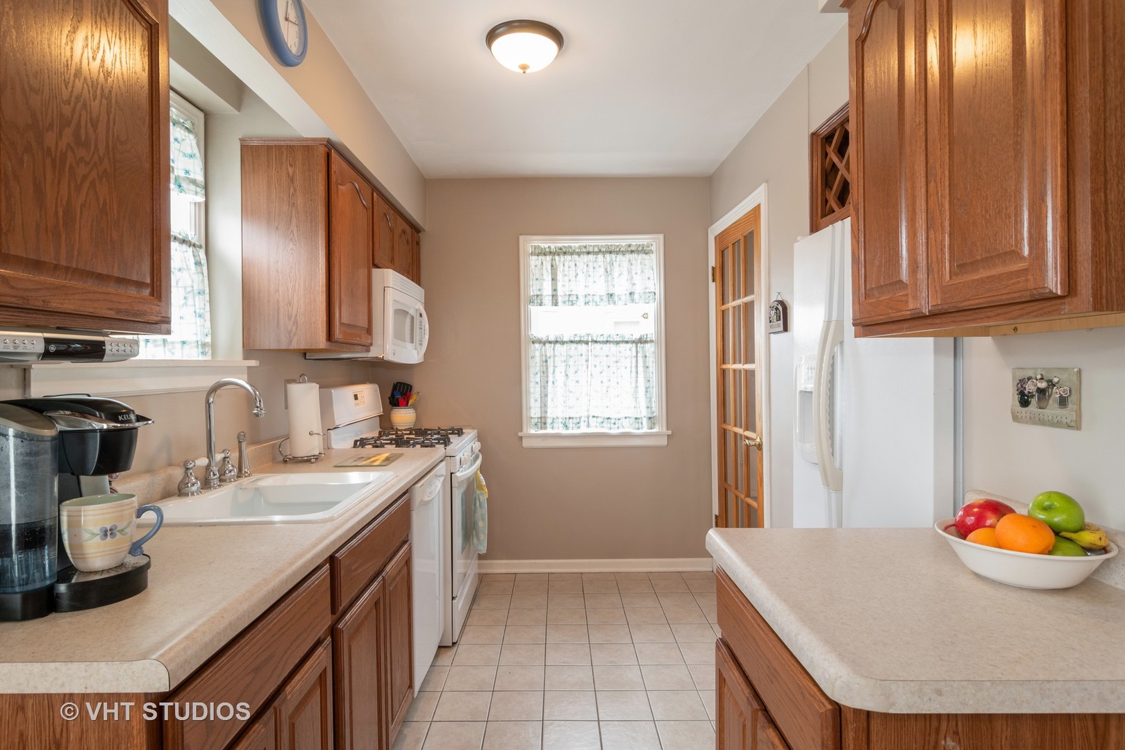 159 East Burlington Street Riverside, IL 60546 - Photo 5 of 19 a kitchen with a sink a stove and cabinets