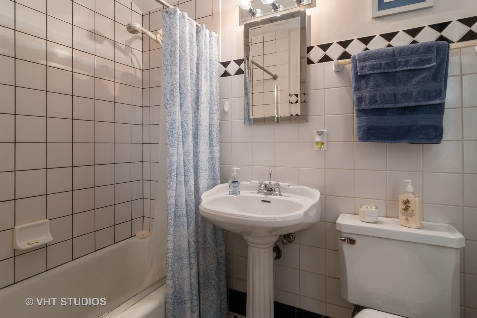 159 East Burlington Street Riverside, IL 60546 - Photo 8 of 19 a bathroom with a sink toilet and shower