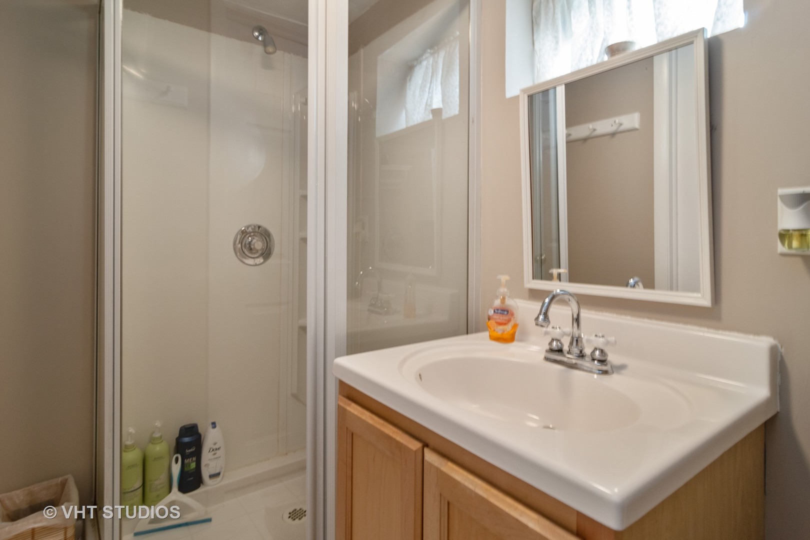 159 East Burlington Street Riverside, IL 60546 - Photo 10 of 19 a bathroom with a sink and a mirror