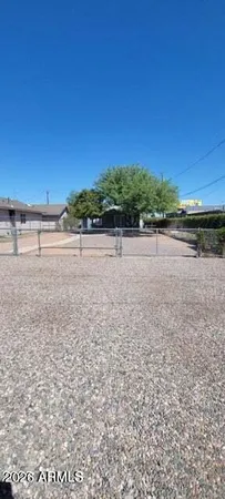 a view of a backyard of the house