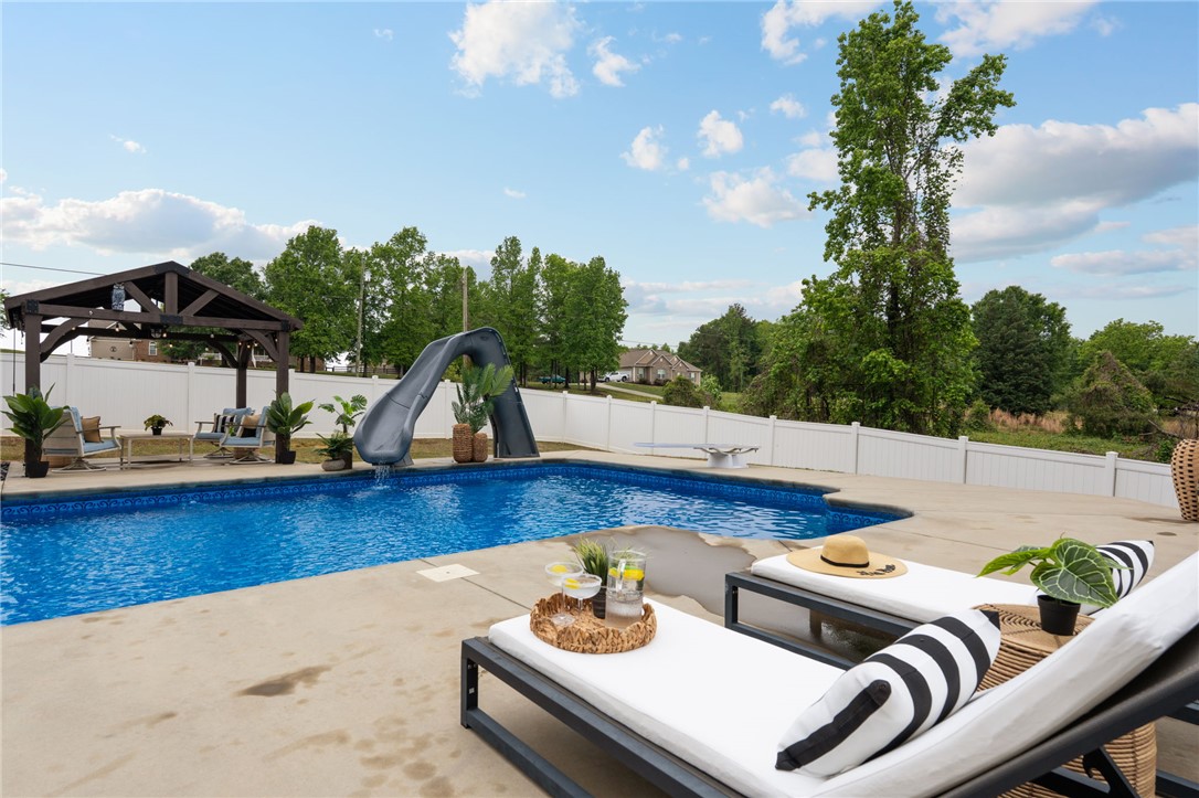 1050 Old Dacusville Road Easley, SC 29640 - Photo 28 of 33 Enjoy outdoor living with a private pool and spacious patio.